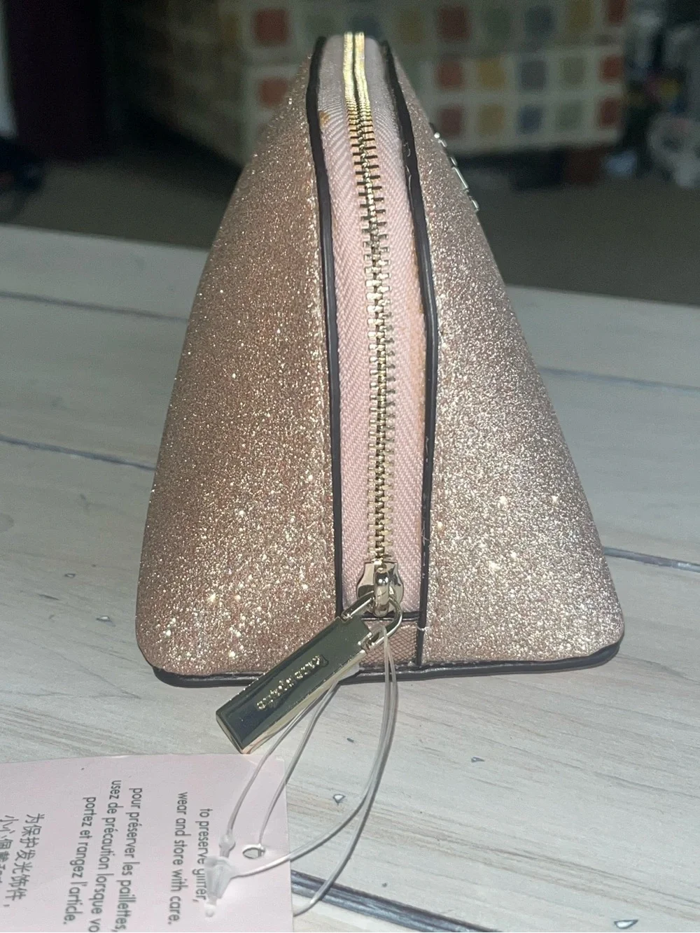 Kate Spade glittery rose gold cosmetic pouch